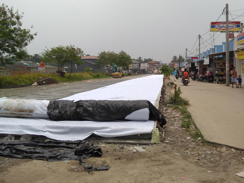 instalasi geotextile curing beton